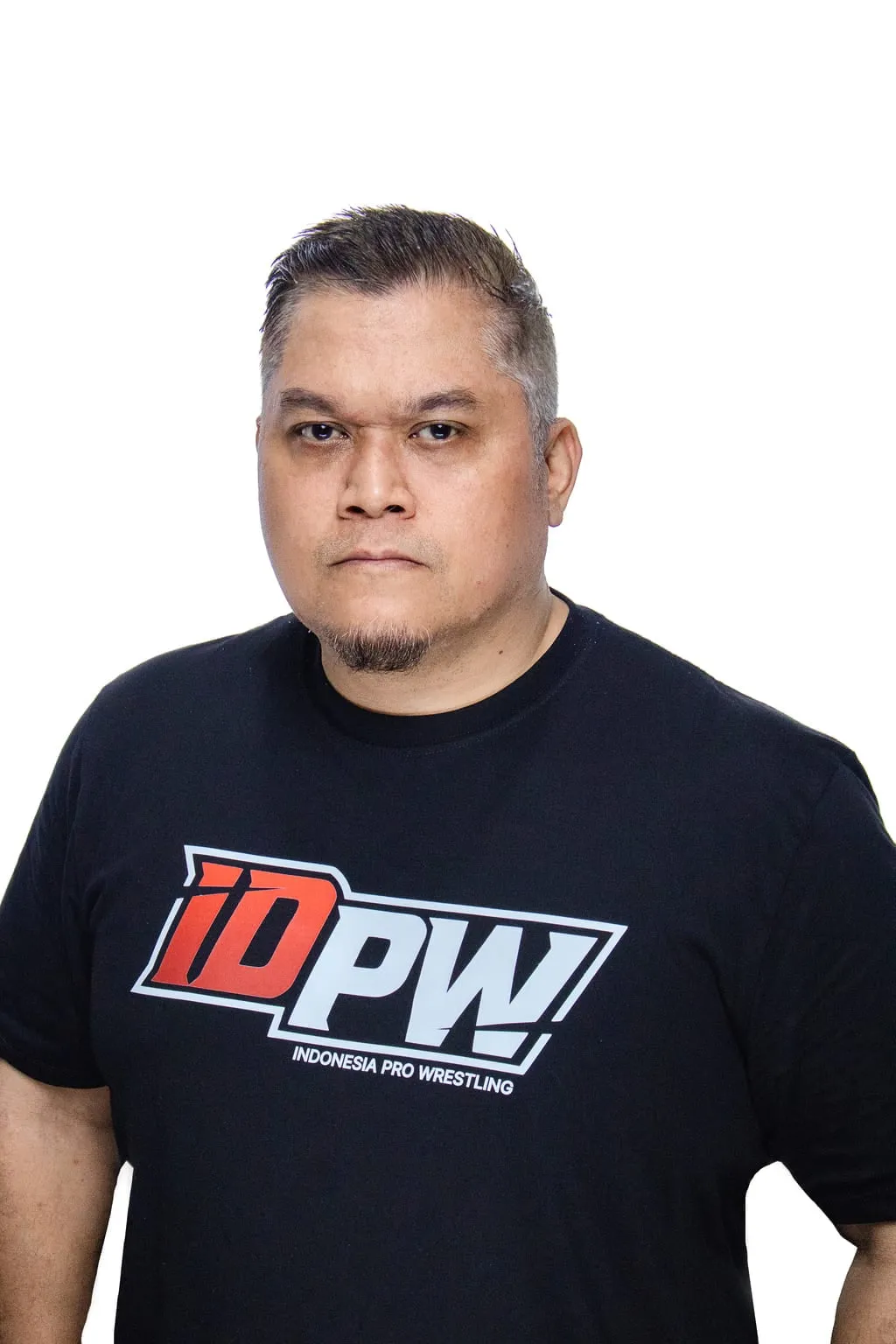 Dimas Soeyono, IDPW head coach, in an IDPW shirt