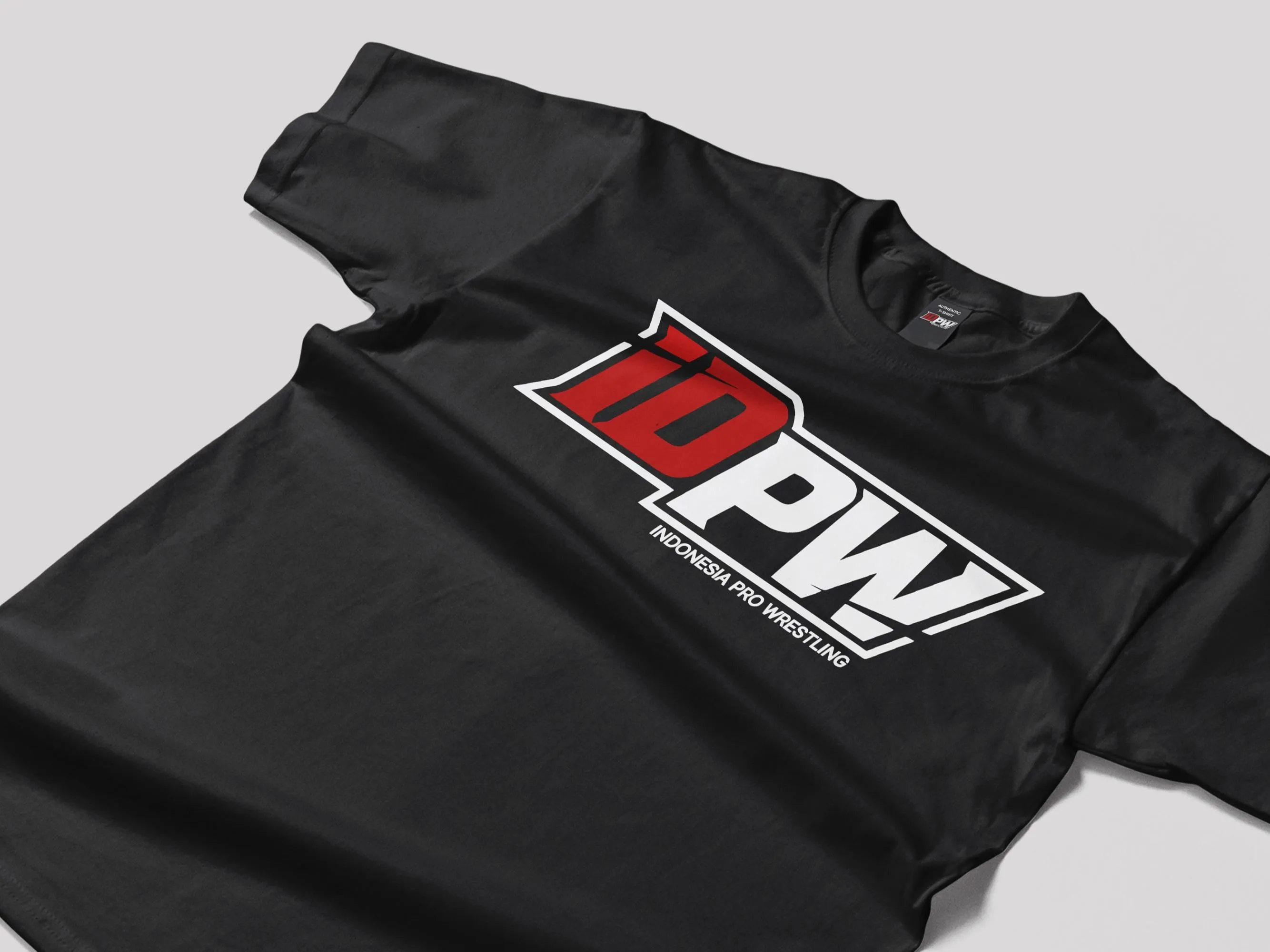 The official IDPW t-shirt: black with the red and white IDPW logo across the chest